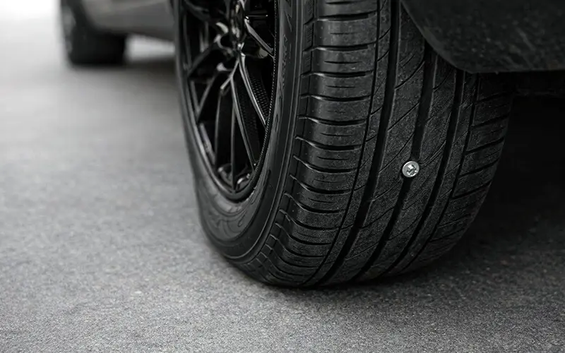 Nail embedded in a tyre tread